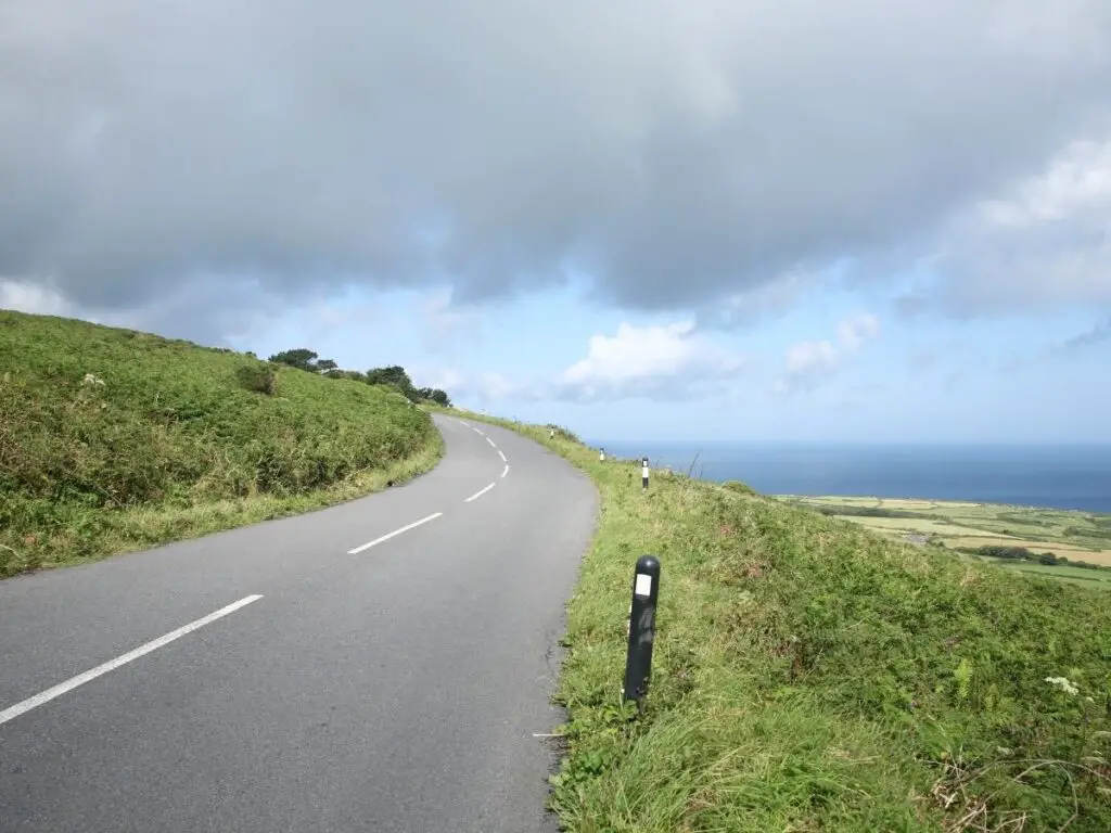 Road in Cornwall with sea in distance