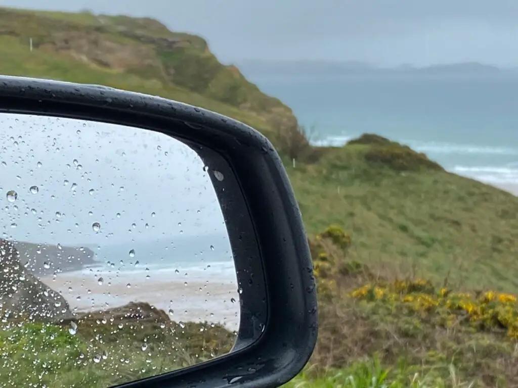 Cornwall beach in car mirror